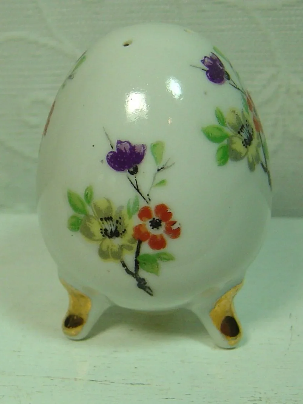 1 only egg shaped ceramic footed salt shaker with floral design